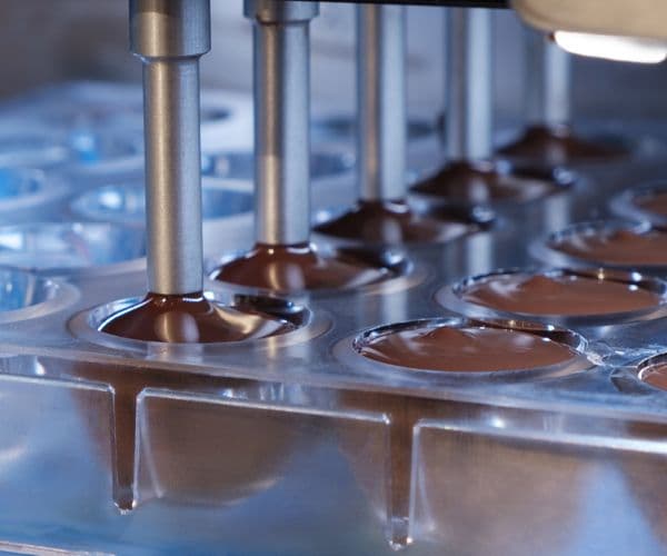 chocolate going through manufacturing and production machines
