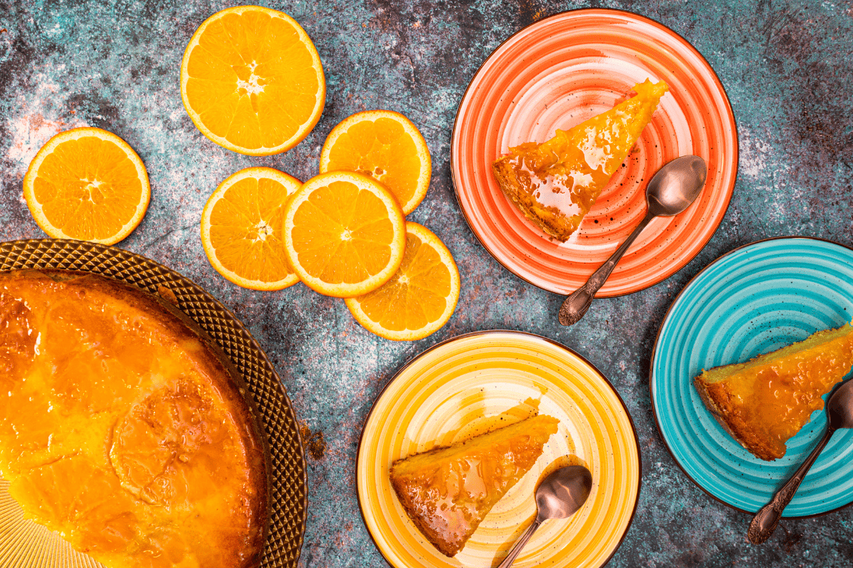 citrus cake with slices oranges and cake pieces